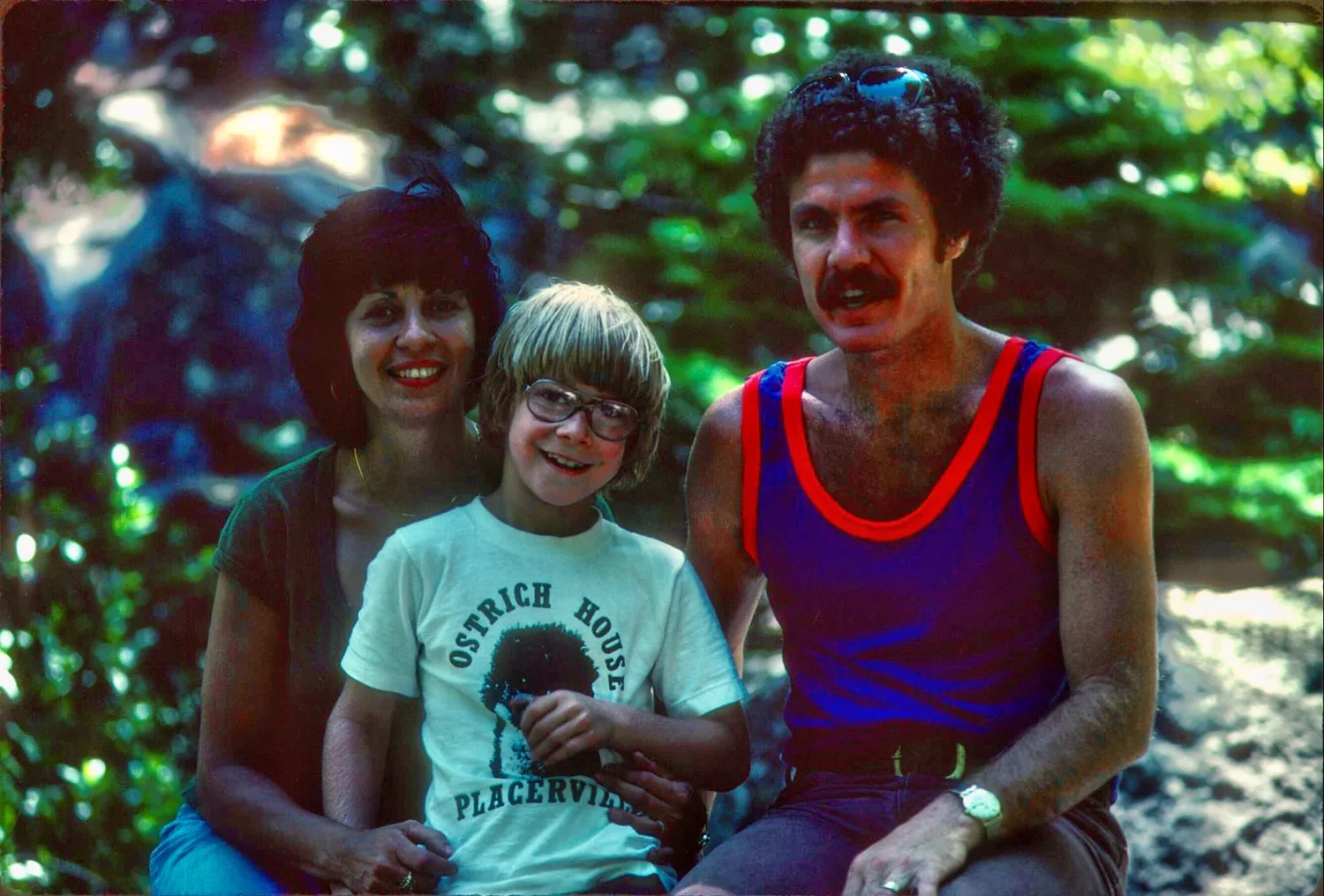 A child wearing an Ostrich House Placerville shirt