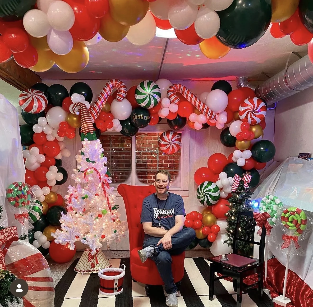 Tony Windle sitting in the Santa chair at T.W. BONKERS